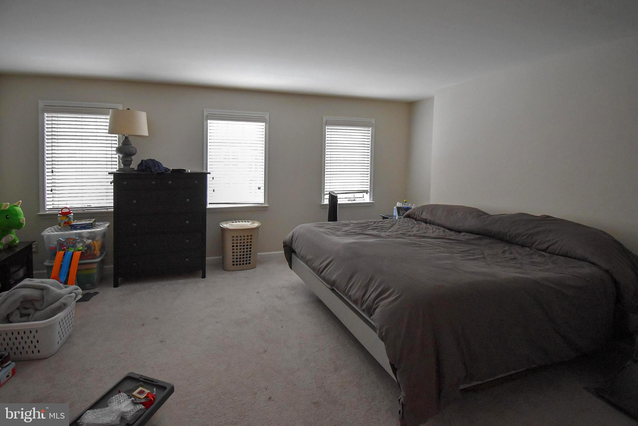 586 Wharton Boulevard Exton, PA 19341 - Photo 14 of 28 a bedroom with a bed and a window