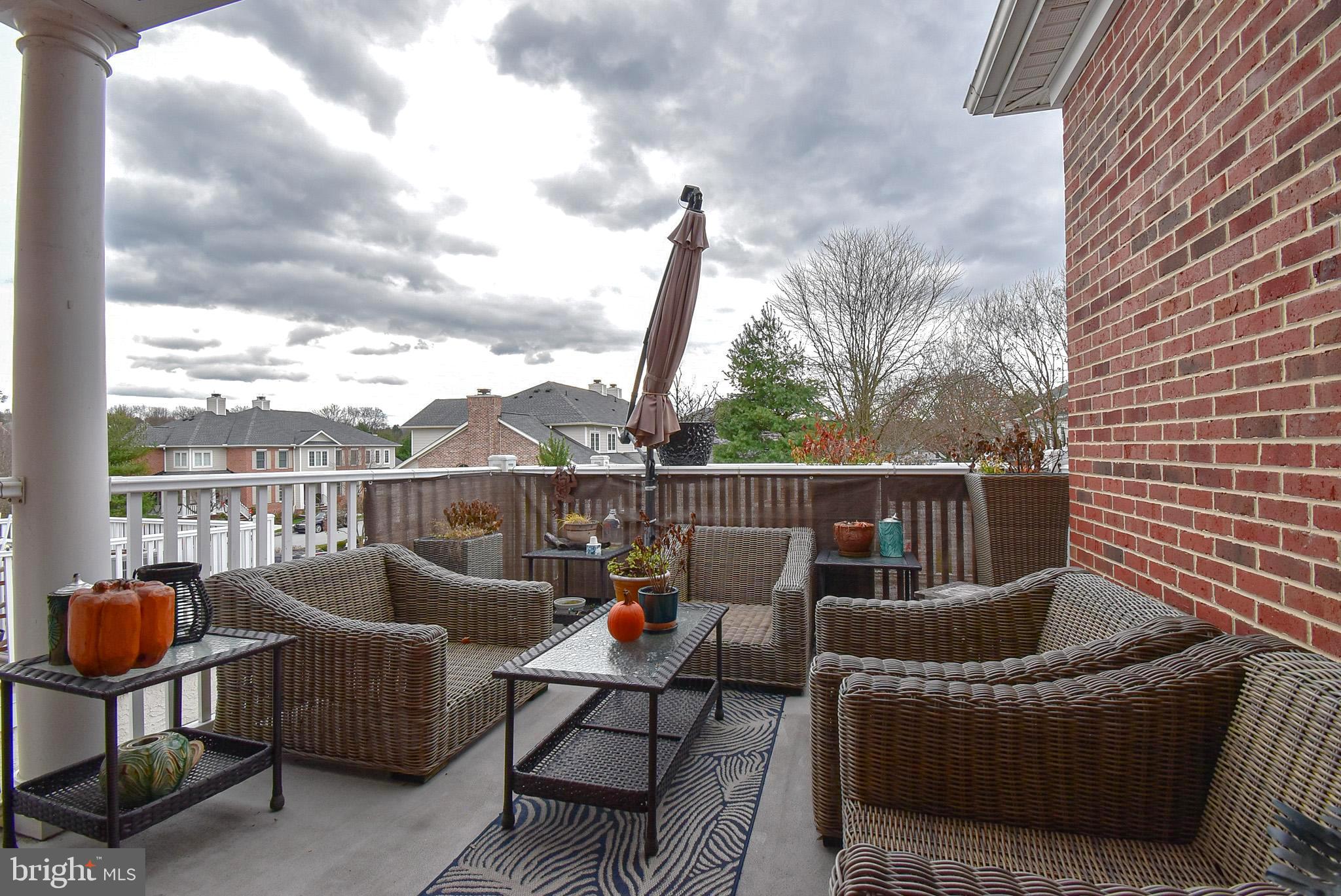 586 Wharton Boulevard Exton, PA 19341 - Photo 26 of 28 a roof deck with couches and wooden floor