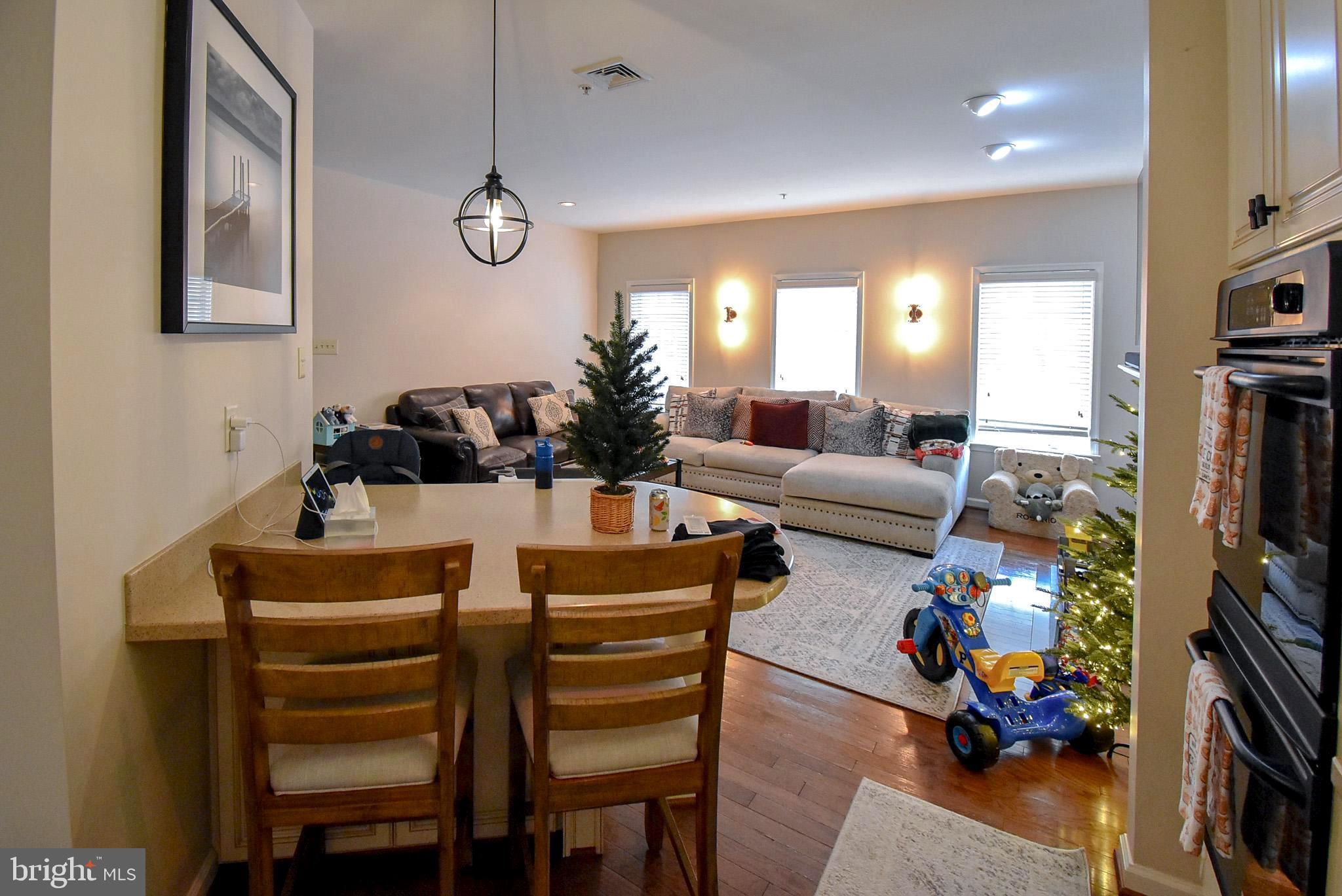 586 Wharton Boulevard Exton, PA 19341 - Photo 4 of 28 a living room with furniture a flat screen tv and a window