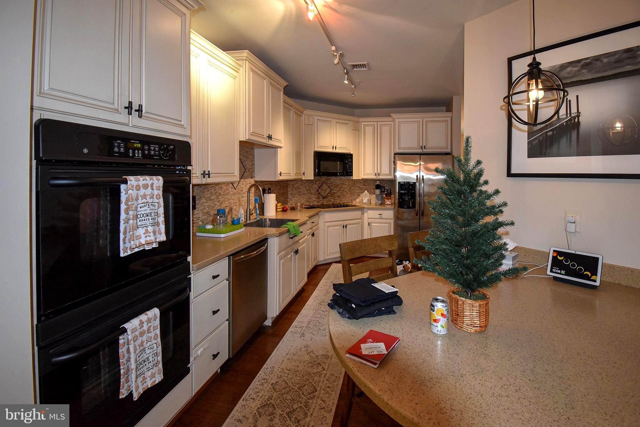 586 Wharton Boulevard Exton, PA 19341 - Photo 6 of 28 a kitchen that has a sink and a stove in it