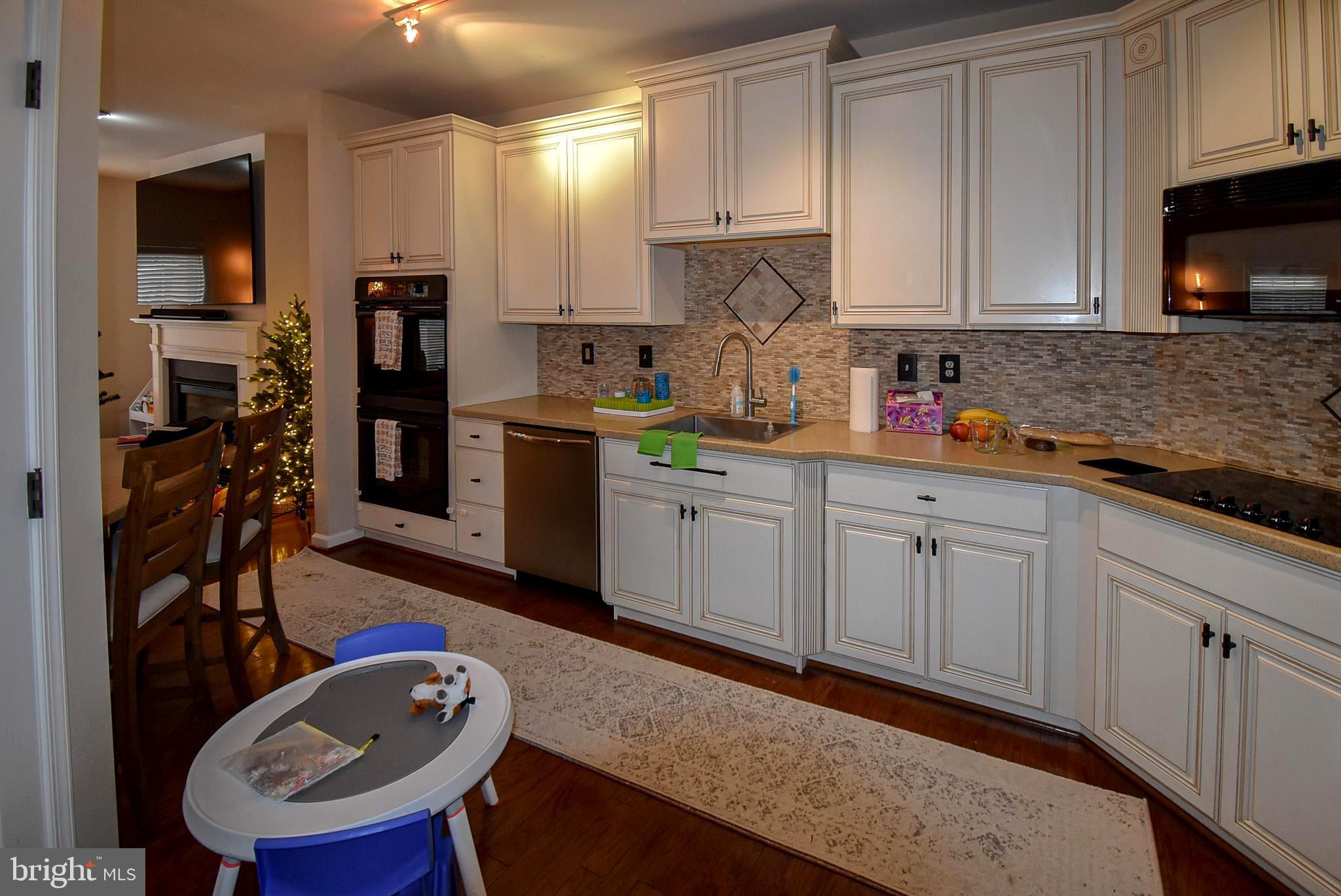 586 Wharton Boulevard Exton, PA 19341 - Photo 8 of 28 a kitchen with stainless steel appliances granite countertop a sink dishwasher stove refrigerator and cabinets