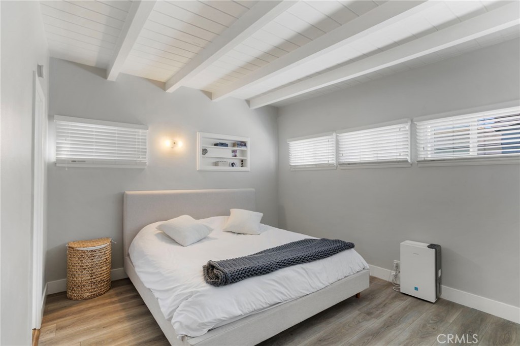 27 66th Place Long Beach, CA 90803 - Photo 16 of 56 a bedroom with a bed and window