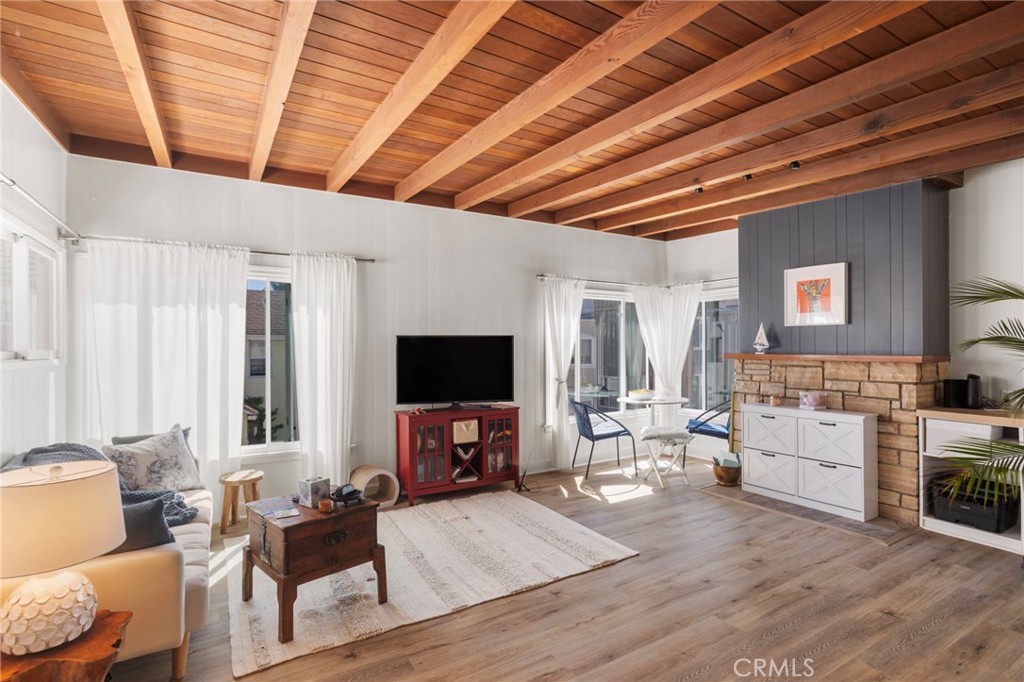 27 66th Place Long Beach, CA 90803 - Photo 23 of 56 a living room with furniture and a flat screen tv