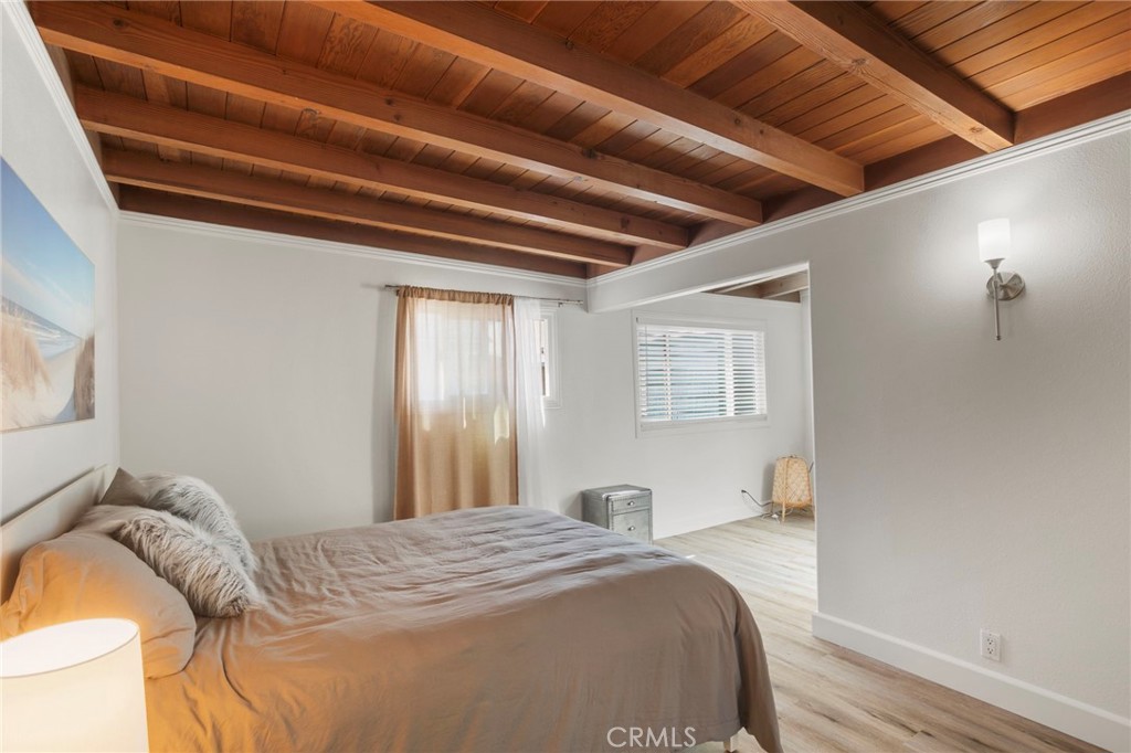 27 66th Place Long Beach, CA 90803 - Photo 31 of 56 a bedroom with a bed and a window