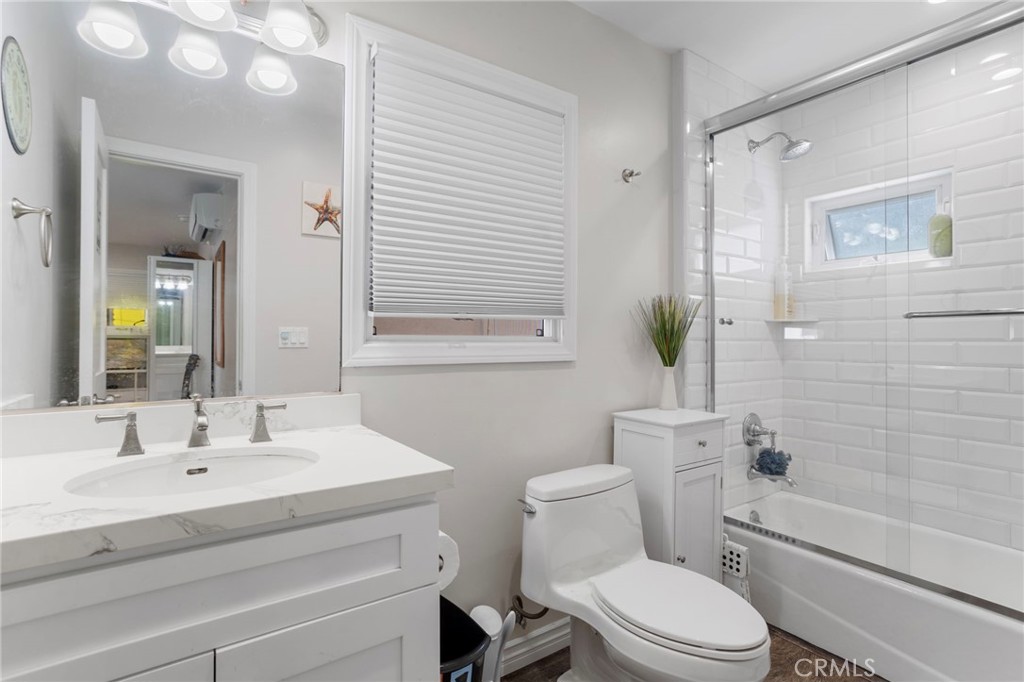 27 66th Place Long Beach, CA 90803 - Photo 35 of 56 a bathroom with a sink a toilet and shower