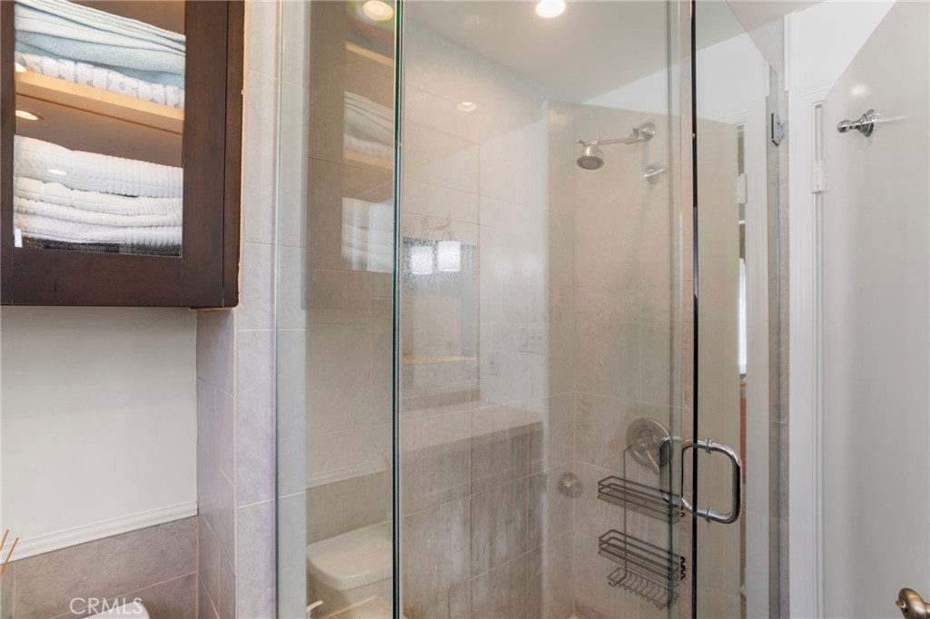 27 66th Place Long Beach, CA 90803 - Photo 38 of 56 a bathroom with a shower and a glass door