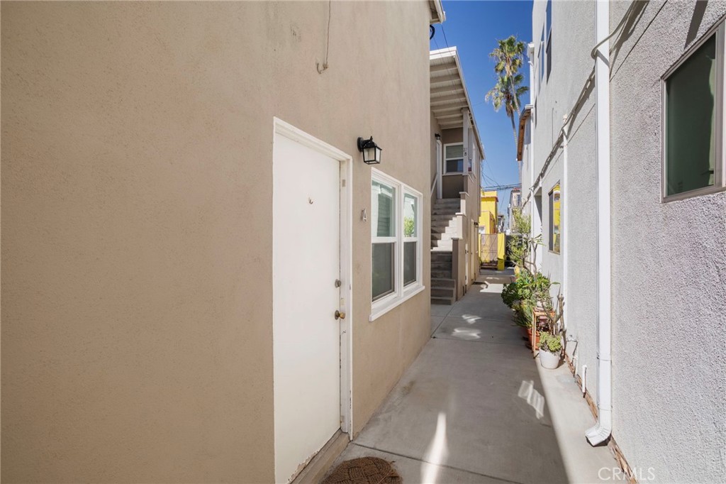 27 66th Place Long Beach, CA 90803 - Photo 6 of 56 a view of a hallway with wooden floor and staircase