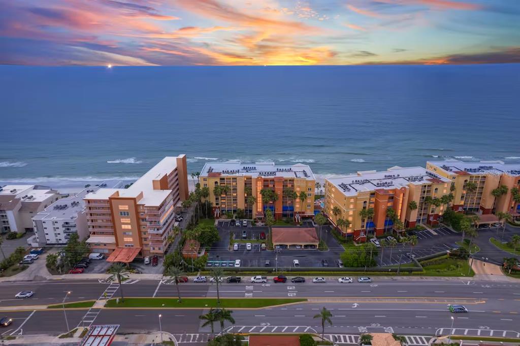 a view of a building with a yard