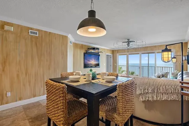 a view of a dining room with furniture window and outside view