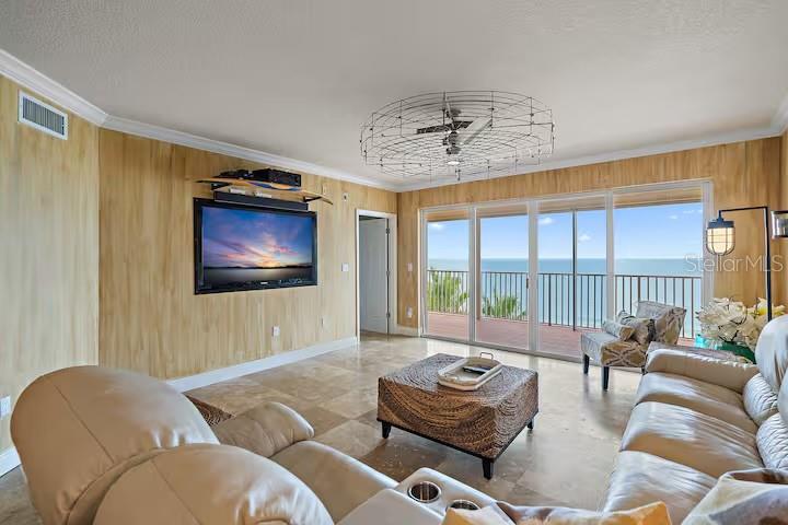16450 Gulf Boulevard, Unit 662 North Redington Beach, FL 33708 - Photo 17 of 37 a living room with furniture and a flat screen tv