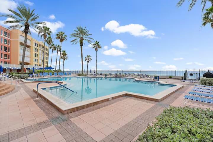 16450 Gulf Boulevard, Unit 662 North Redington Beach, FL 33708 - Photo 33 of 37 a view of swimming pool with a table and chairs