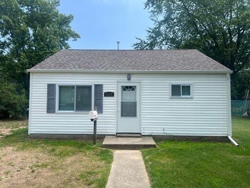 3137 Pulaski Street Hobart, IN 46342 - Photo 1 of 1 a front view of a house with garden