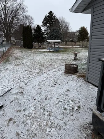 a view of a backyard with furniture