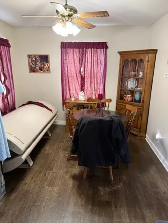 a bed sitting in a room next to a window