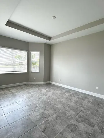 a view of an empty room with a window