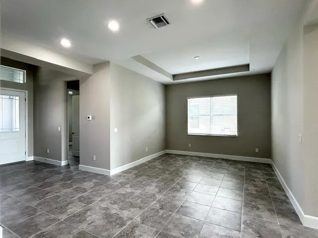 a view of an empty room with a window