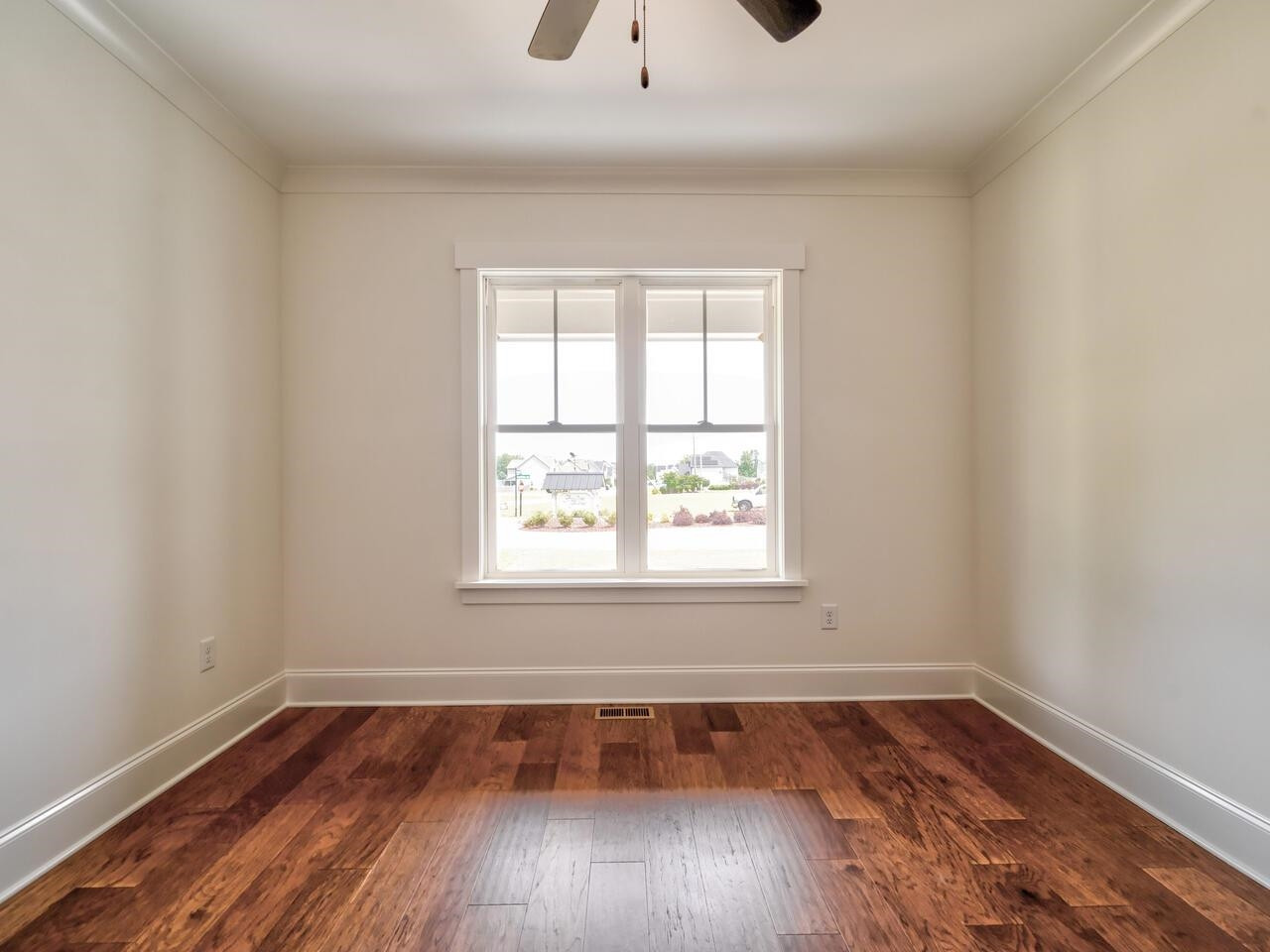 16 Constitution Avenue Smithfield, NC 27577 - Photo 24 of 60 an empty room with wooden floor and windows