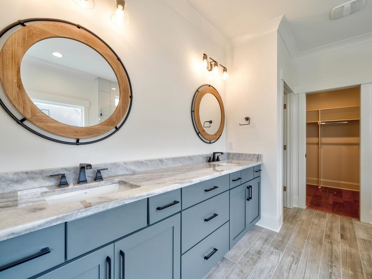 16 Constitution Avenue Smithfield, NC 27577 - Photo 30 of 60 a bathroom with a granite countertop double vanity sink and a mirror