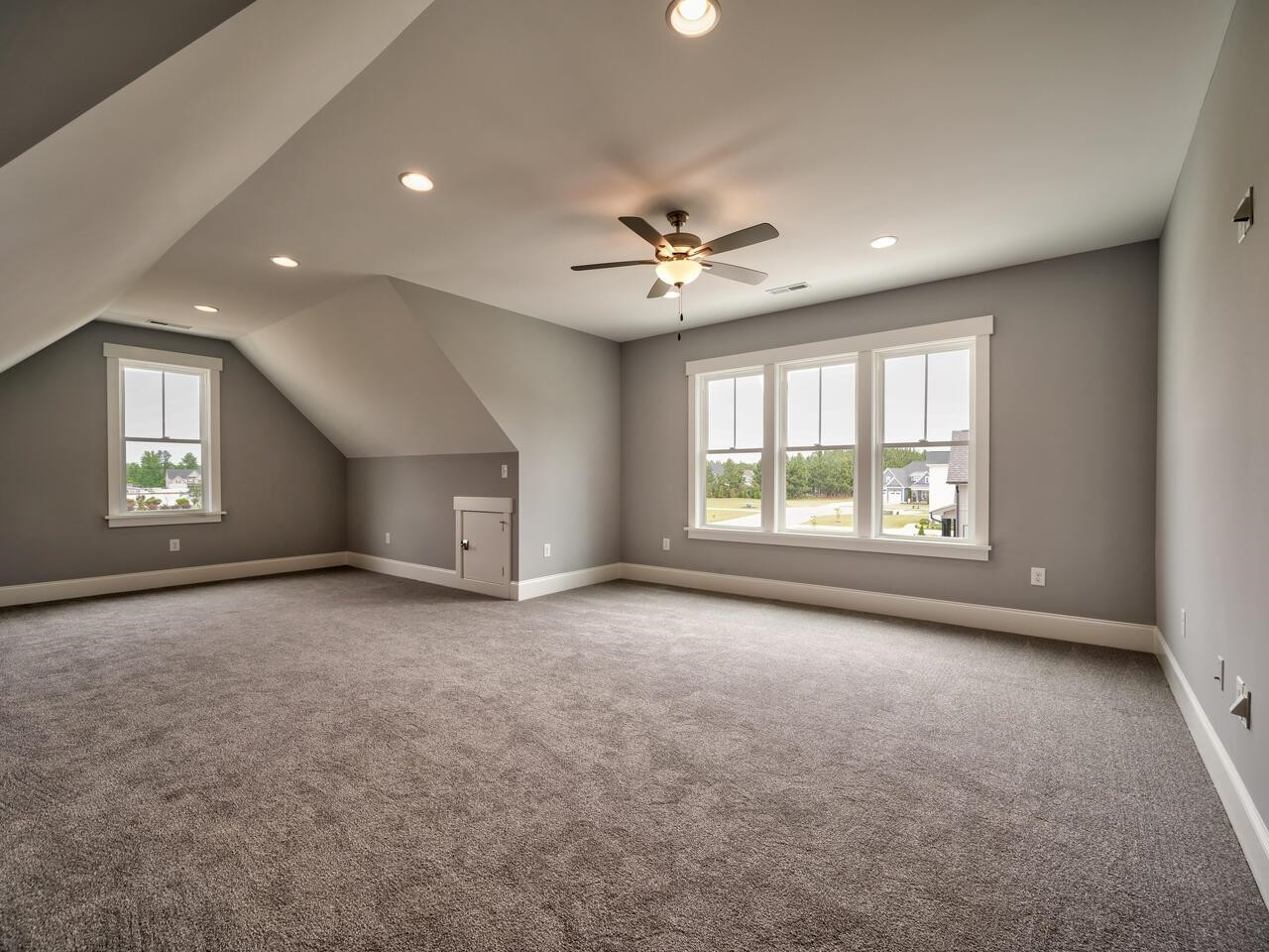 16 Constitution Avenue Smithfield, NC 27577 - Photo 44 of 60 a view of a livingroom with a ceiling fan and window