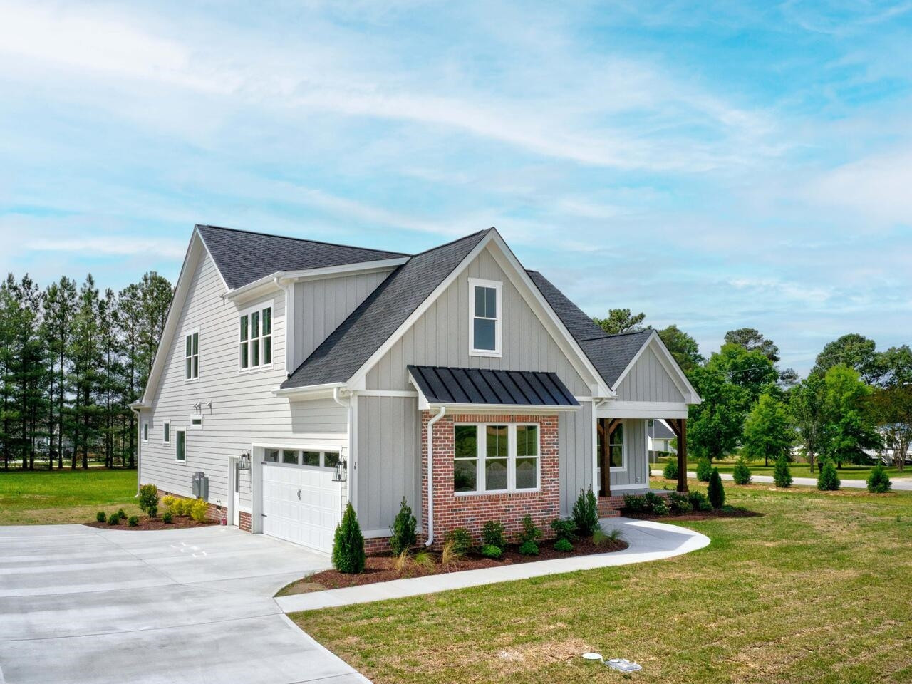 16 Constitution Avenue Smithfield, NC 27577 - Photo 55 of 60 a front view of a house with a yard