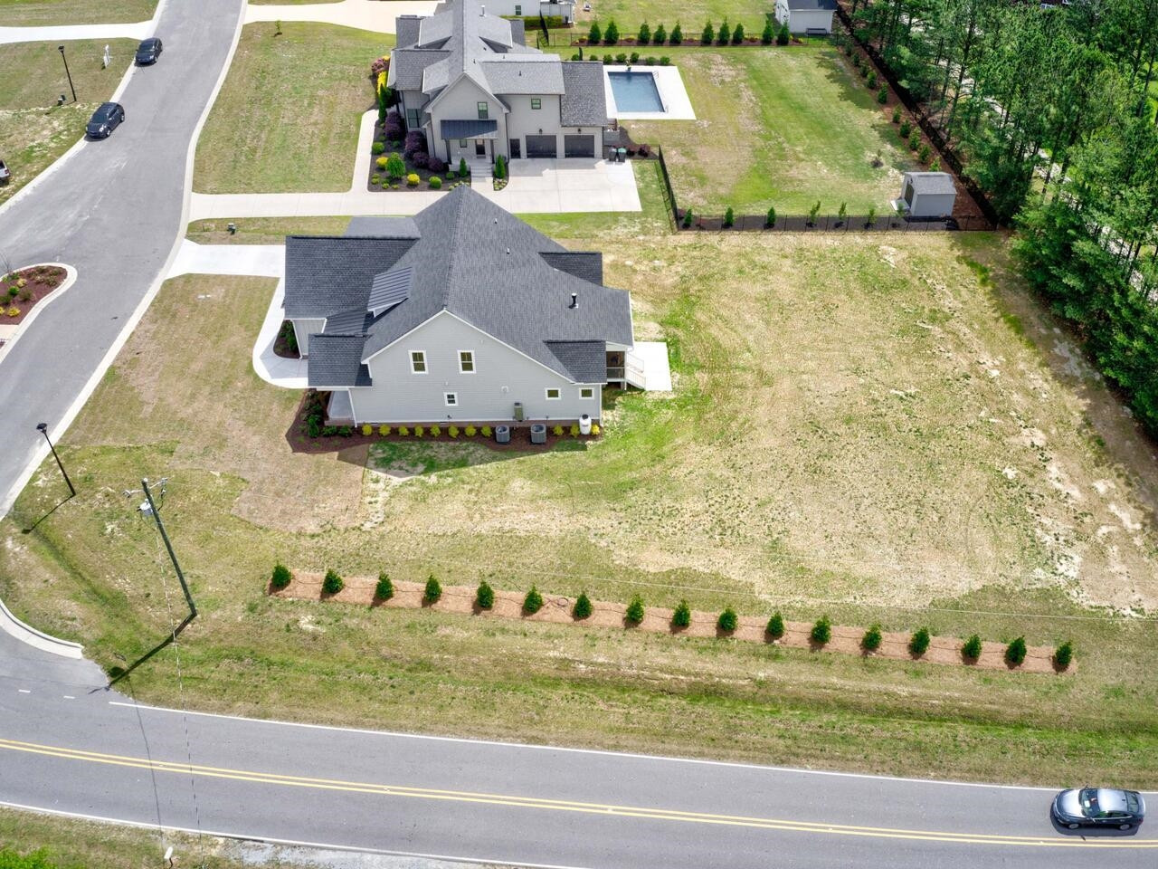 16 Constitution Avenue Smithfield, NC 27577 - Photo 58 of 60 a view of swimming pool with a yard and seating area