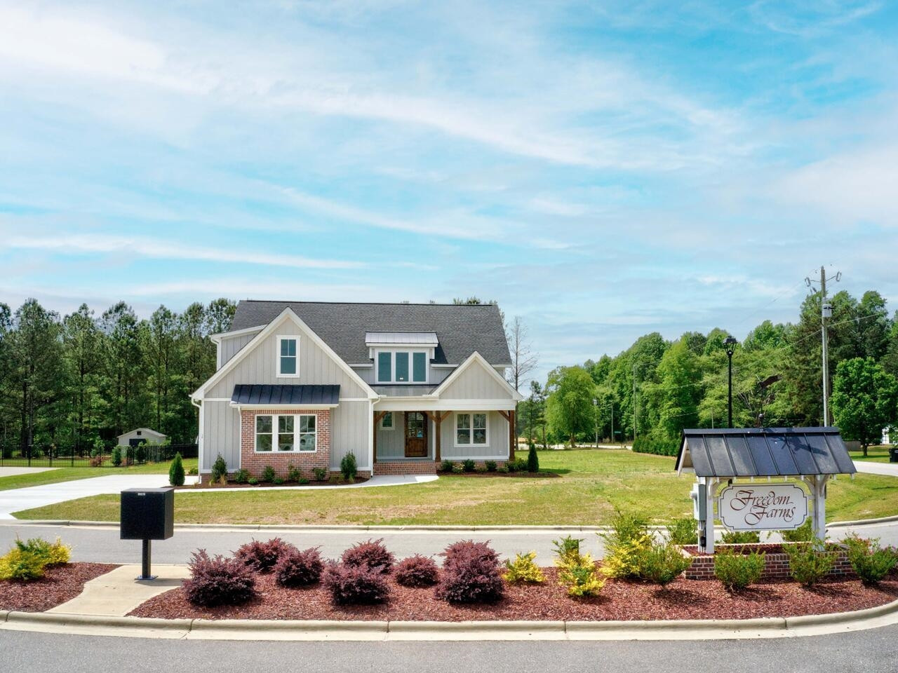 16 Constitution Avenue Smithfield, NC 27577 - Photo 60 of 60 a front view of a house with a yard table and chairs