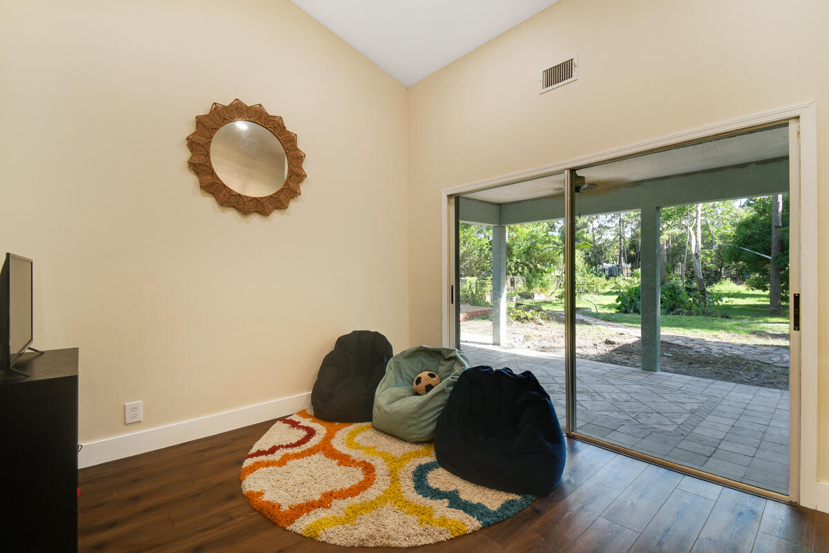 12792 Old Indiantown Road Jupiter, FL 33478 - Photo 28 of 60 LISING ROOM OPEN TO PATIO