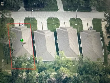 an aerial view of residential house with outdoor space and swimming pool