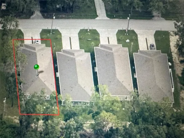 an aerial view of residential house with outdoor space and swimming pool