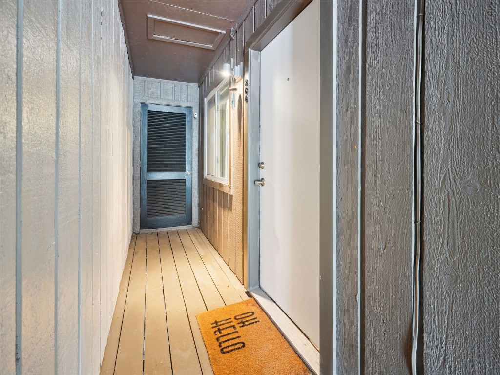 1503 West 9th Street, Unit 204 Austin, TX 78703 - Photo 14 of 21 a view of a hallway with wooden floor and staircase