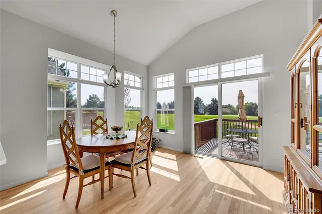 a bedroom with a bed and flat tv screen on dresser