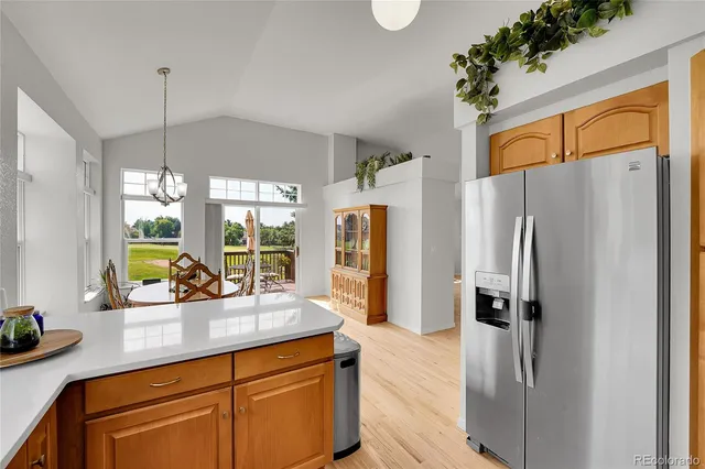 a view of a room with gym equipment and windows