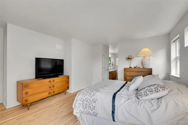 a living room with a fireplace and a window