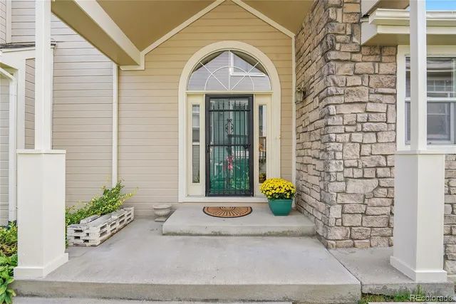 a living room with furniture fireplace and window