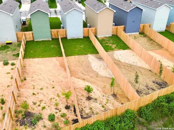 a view of an house with backyard space and garden