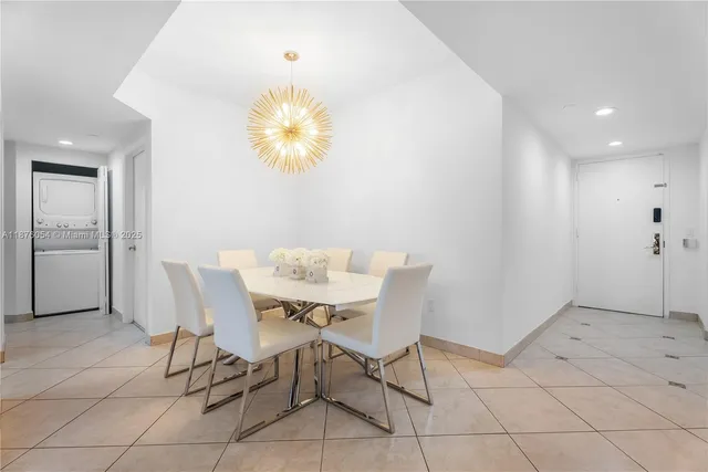 a living room with furniture a rug and a large window