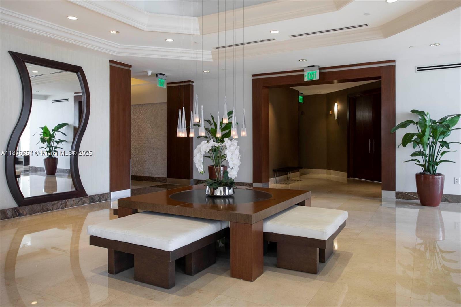 4779 Collins Avenue, Unit 1008 Miami Beach, FL 33140 - Photo 36 of 36 a living room with granite countertop furniture and potted plant