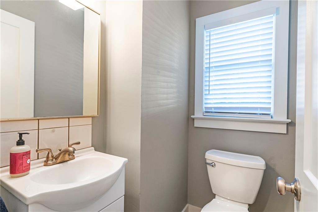1403 Lavista Road Northeast Atlanta, GA 30324 - Photo 17 of 43 a bathroom with a toilet sink and mirror