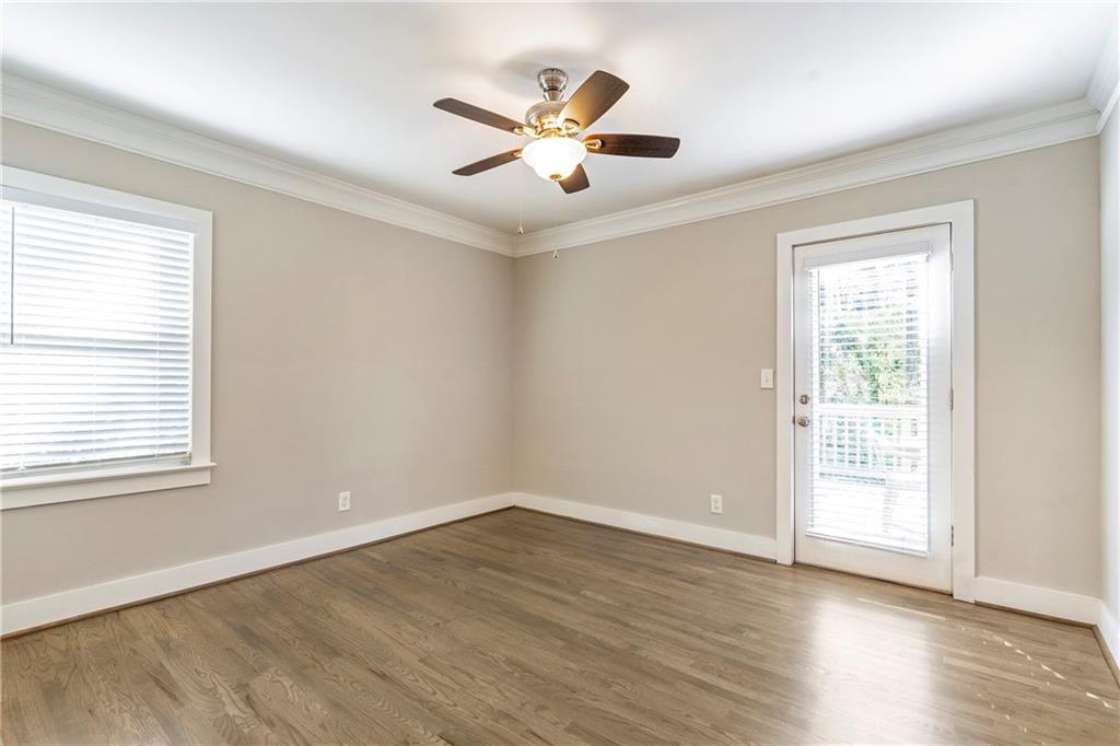 1403 Lavista Road Northeast Atlanta, GA 30324 - Photo 20 of 43 an empty room with wooden floor and windows