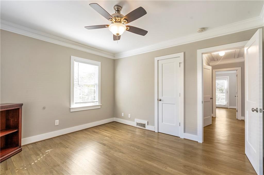 1403 Lavista Road Northeast Atlanta, GA 30324 - Photo 22 of 43 a view of an empty room with wooden floor and a window