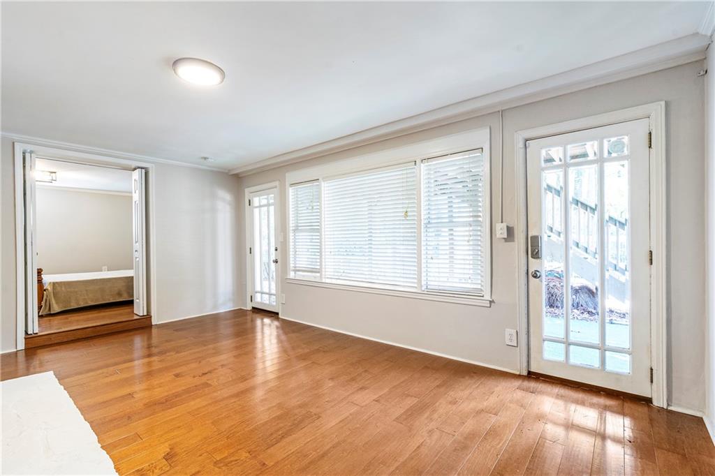 1403 Lavista Road Northeast Atlanta, GA 30324 - Photo 26 of 43 an empty room with wooden floor and windows
