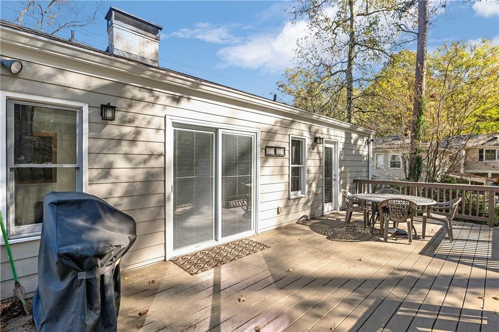 1403 Lavista Road Northeast Atlanta, GA 30324 - Photo 35 of 43 a balcony with table and chairs and potted plants