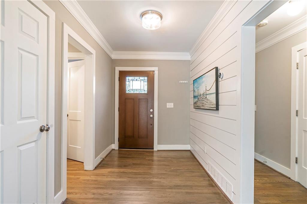 1403 Lavista Road Northeast Atlanta, GA 30324 - Photo 4 of 43 a view of a hallway with wooden floor and closet