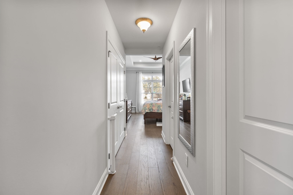 55 Phoebe Street, Unit 32 Methuen, MA 01844 - Photo 12 of 42 a view of a hallway with wooden floor and staircase