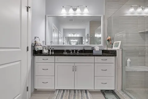 a bathroom with a sink and a mirror