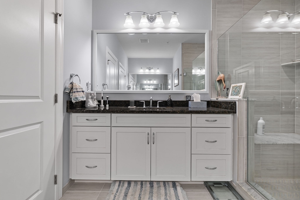 55 Phoebe Street, Unit 32 Methuen, MA 01844 - Photo 16 of 42 a bathroom with a sink and a mirror