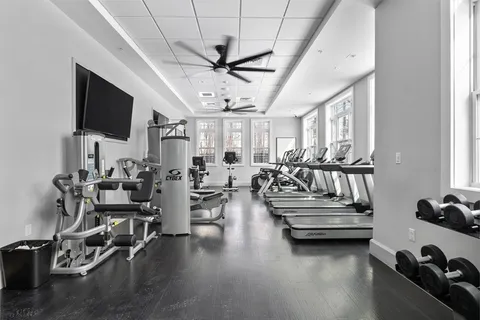 a living room with lots of furniture and a flat screen tv