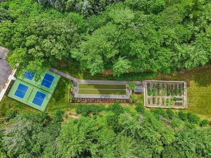 a view of an outdoor space and tennis court