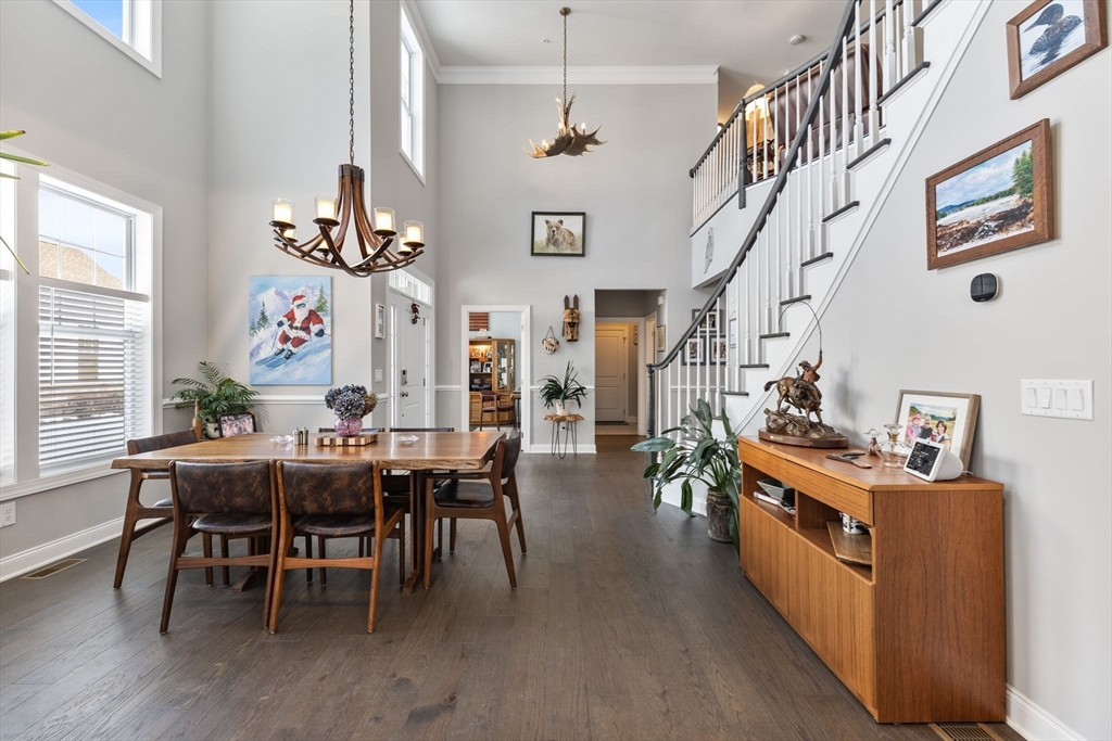 55 Phoebe Street, Unit 32 Methuen, MA 01844 - Photo 5 of 42 a view of a dining room with furniture window and wooden floor