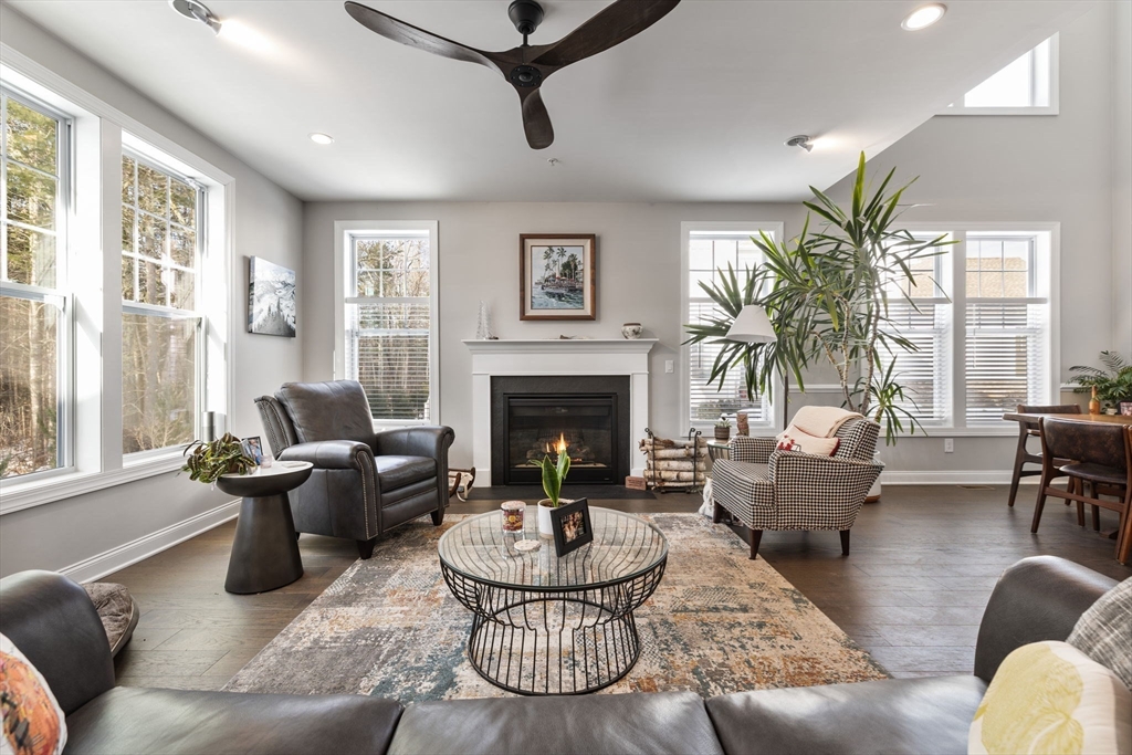 55 Phoebe Street, Unit 32 Methuen, MA 01844 - Photo 6 of 42 a living room with furniture and a fireplace